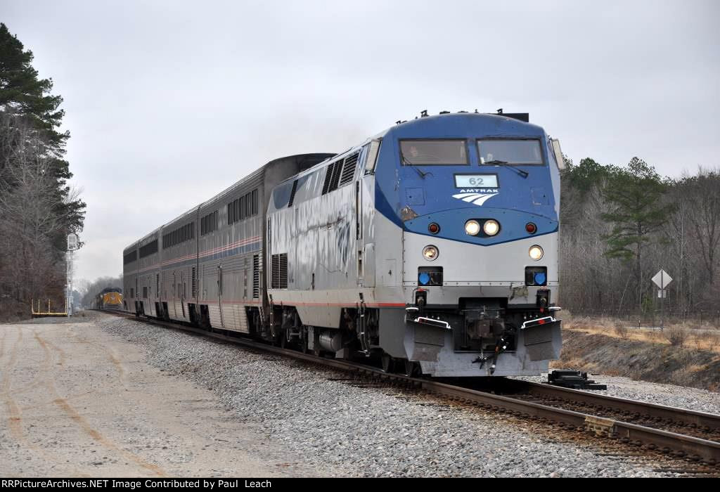 "Texas Eagle" rolls west past a maifest in the siding